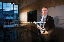 Shane Farritor holds his surgery robot in the prototyping area of Nebraska Innovation Campus' Innova