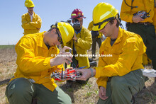 Liquid is reloaded into the drone's platform so another flight can take off. Controlled burn at the 