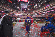 Chancellor Harvey Perlman stands in a confetti shower at the end of commencement.  The confetti was 