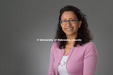 Studio portrait of Maria Elena Villasante Arce, Family School Consultant, CEHS. August 12, 2016. 