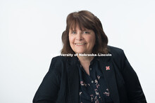 Studio portrait of Cheri Oltman, Staff Secretary, College of Journalism and Mass Communication. Marc