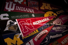 Collage of Big Ten College Pennants. Original photo has been altered to show new logo and add Rutger