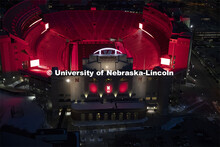 Memorial Stadium is a big red anchor to the colorful city campus Thursday night. Glow Big Red bathes