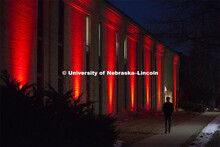 The Home Economics building lit up red during Glow Big Red. Glow Big Red bathes the campuses with re