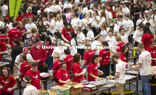 Volunteers fill the Coliseum as they fuel up on donated food before they head out to their job sites