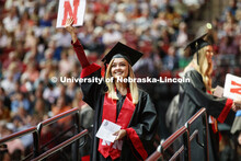 Sydney Mischnick shows off her College of Education and Human Sciences degree to family and friends.