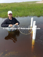 Researchers with the University of Nebraska-Lincoln take groundwater samples from the Loup River in 