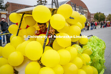 Triad 8's golf cart rolls along the parade route. Triad 8's members are Sigma Chi, Chi Omega, Alpha 