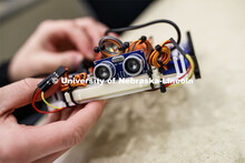Students in Mark Bauer ECEN 102 - Introduction to Electrical Engineering class work on small robots 
