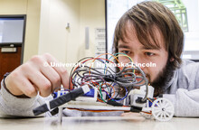 Students in Mark Bauer ECEN 102 - Introduction to Electrical Engineering class work on small robots 