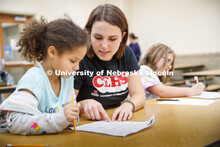 Samantha Wolff, a senior secondary education major, works with Hartley Elementary students during th