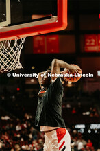 Jervay Green warms up by slam dunking a ball. Nebraska vs. Wisconsin State University men’s basket