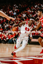 Cam Mack drives the ball to the net. Nebraska vs. Wisconsin State University men’s basketball game