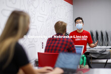 Students wear masks as they study in the Lynn and Dana Roper Media Studio in Anderson Hall. Photo sh