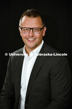 Studio portrait of Robert Mackalski, Assistant Director of Branding, College of Business, New Facult