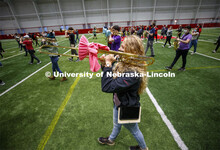 Regan Hennings practices marching as both she and her trombone are properly covered. One third of th
