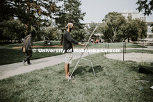 Saeed Almahrooqi works on his drawing for Chip Stanley's DSGN120 Design Drawing class. Outdoor class
