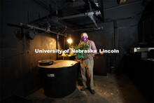 Bryan Leavitt, Manager Research Systems Survey Division - School of Natural Resources, holds a plant