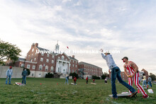Students toss beanbags during the ASUN Cornhole Competition at the Cather-Pound Greenspace on Wednes