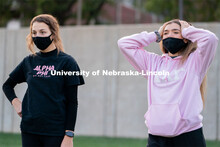 Kappa Kappa Gamma’s Liz Stacy (right) reacts to an errant throw during the ASUN Cornhole Competiti