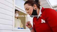 Jessica Calvi, a research assistant professor with the Nebraska Athletic Performance Lab, demonstrat
