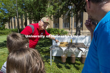 Paul Jassa, Extension Engineer with Biological Systems Engineering, demonstrates with a spray table 