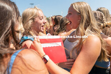 Students hug their new sorority members during Sorority Rush Bid on the Vine Street fields. Sorority
