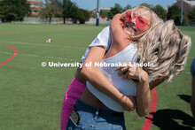 Students hug their new sorority members during Sorority Rush Bid on the Vine Street fields. Sorority