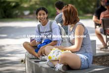 Mency Orellana and Rayni Wekluk talk outside the union. Students lined up at the Inaugural Soph S’