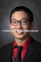 Studio portrait of John Tessalee, Program Coordinator, OASIS. September 1, 2021. 