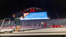 Air Force ROTC members and cadre run the north stadium steps under the video board Thursday morning.