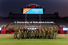 UNL ROTC cadets pose for a group photo after running the steps of Memorial Stadium to honor those wh