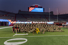 UNL ROTC cadets pose for a group photo after running the steps of Memorial Stadium to honor those wh