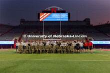UNL ROTC cadets pose for a group photo after running the steps of Memorial Stadium to honor those wh