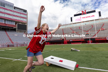 Abi Schoup, a senior on the mortar board team, reacts after scoring a cornhole. Homecoming Cornhole 