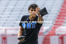 Sam Bates, a junior with the Phi Beta Sigma (National Pan-Hellenic Council) NPHC team, throws a bag 