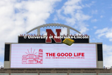 A bag sails through the air against the backdrop of the Memorial Stadium video screen. Homecoming Co