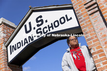Nasia Olson-Whitefeather looks over the former rodeo grounds that was part of the school. Students f
