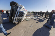 Researchers and invited guests look over the tanker following the crash test. Researchers from the M