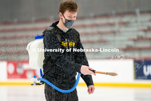 Seamus Hurley prepares the ice for curling at the John Breslow Ice Hockey Center. Curling Club. Febr