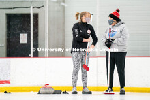 University of Nebraska Curling Club adviser Nancy Myers (right) and Emma Whaley (left) speak to each