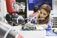 Kimia Ameri works with a robotic arm in Hamid Sherif’s lab. College of Engineering photo shoot at 