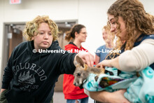 Students pet animals during the End of Year Bash inside the East Campus Union on Saturday, April 30,