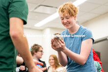 Students pet animals during the End of Year Bash inside the East Campus Union on Saturday, April 30,