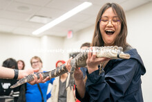 Students pet animals during the End of Year Bash inside the East Campus Union on Saturday, April 30,
