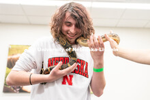 Students pet animals during the End of Year Bash inside the East Campus Union on Saturday, April 30,