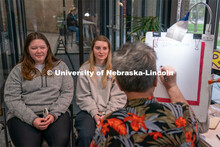 A caricature artist draws students during the End of Year Bash inside the East Campus Union on Satur