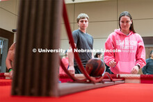 Students play carnival games during the End of Year Bash inside the East Campus Union on Saturday, A