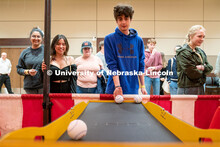 Students play carnival games during the End of Year Bash inside the East Campus Union on Saturday, A