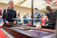 Students play carnival games during the End of Year Bash inside the East Campus Union on Saturday, A